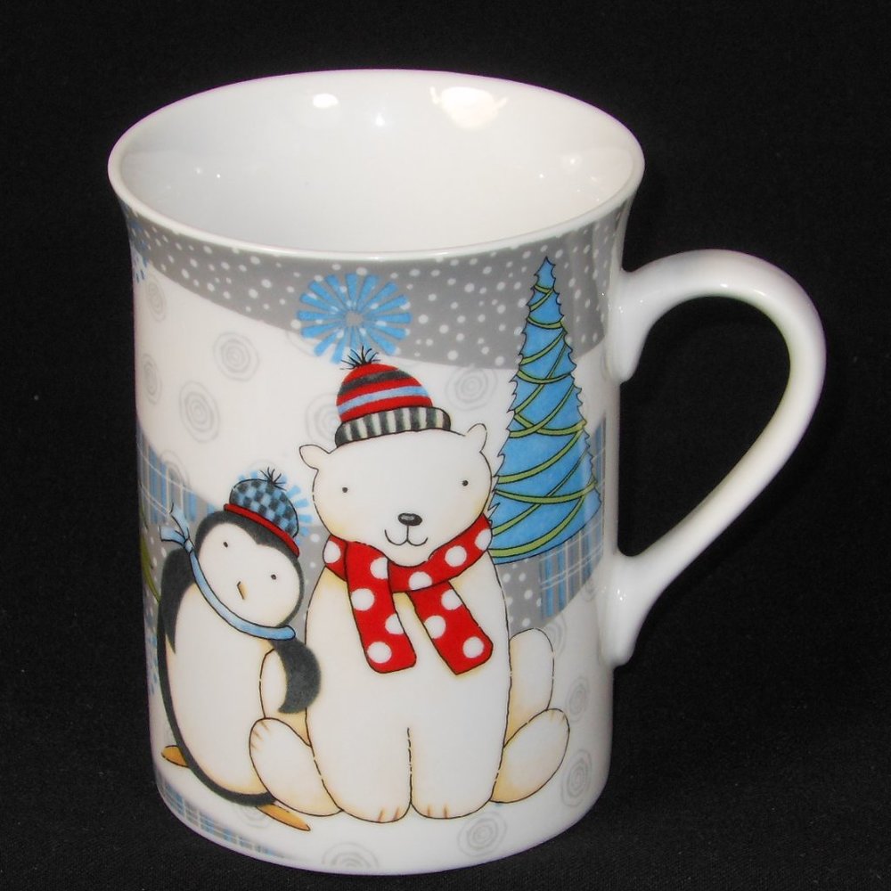 Colorful coffee mug.  DEBBIE MUMM winter animals.